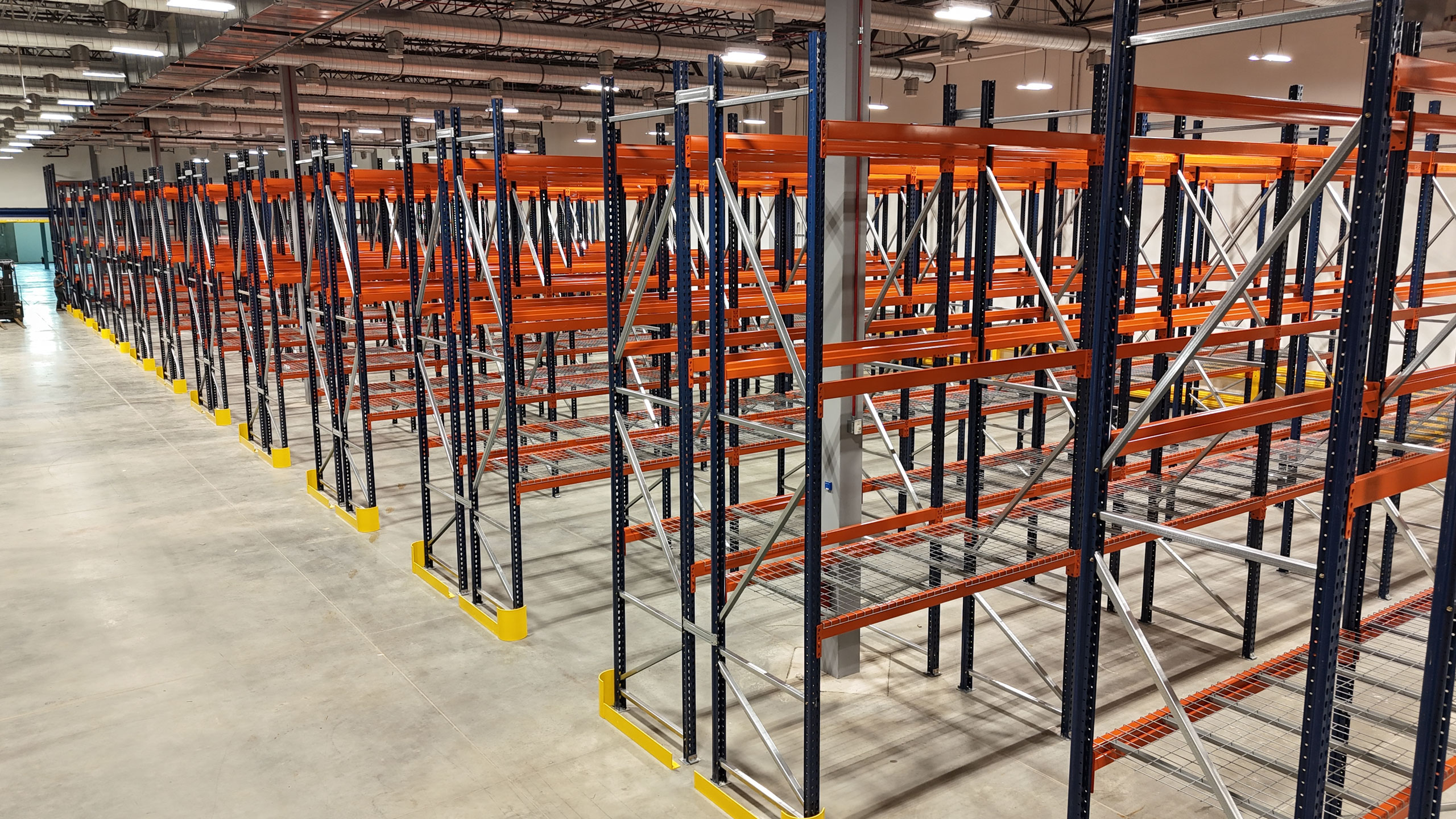 Rows of storage racks within a controlled ambient environment